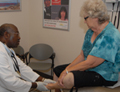 Picture of patient having foot examined